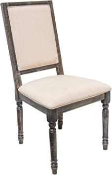 an old wooden chair with beige fabric seat padding and wood frame, isolated against a white background