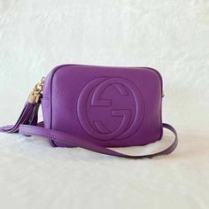 Description:   Gucci Soho Small Purple Leather Disco Bag  Includes Dustbag  Condition: Pre/Loved in Very Good Condition. Slight Discoloration at Edges. Some Marks on the Inside.  Estimated Retail: $1,360 Details: Purple Grained Leather / Light Gold-Tone HardwareAdjustable Shoulder Strap Logo at Front / Tassel at SideNatural Canvas at Interior / Dual Slit Pockets Zipper Closure at Top Measurement: Width 21cm / Height 15cm / Depth 7cm   For more details on this item, contact us on bagsalora@gmail.com or +1 307 216-5225 Gucci Soho, Diaper Bag Backpack, Purple Leather, Purple Bags, Vuitton Bag, Sierra Leone, Bags Designer Fashion, Exclusive Bag, Casual Backpack