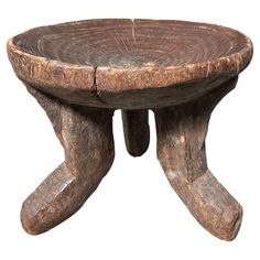 an old wooden stool sitting on top of a white background