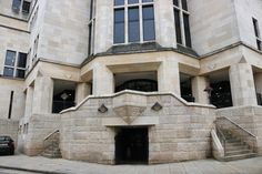 an entrance to a building with stairs leading up to it