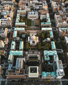 an aerial view of a city with lots of tall buildings