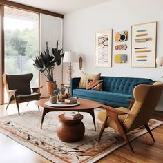 a living room filled with furniture and lots of windows