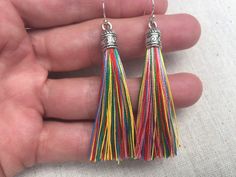 "Chic multi color tassel earrings! They would add a pop of color to any outfit for any occasion. Dress them up or down. They are timeless and versatile. They are lightweight, fun and unique! The tassels measure 2 1/8\" long by 1/4\" wide. They hang from simple silver ear wire hooks. Overall drop length is about 2 1/4\". Metal is allergy free plated silver. These are my latest creation! I have them available in many colors! Find them all under the category tassel earrings in my shop. Thanks for s Rainbow Tassel Earrings For Gifts, Rainbow Dangle Tassel Earrings Gift, Colorful Dangle Tassel Earrings Gift, Rainbow Fringe Earrings As Gift, Multicolor Tassel Earrings As A Gift, Rainbow Tassel Dangle Earrings, Rainbow Dangle Tassel Earrings, Bohemian Rainbow Tassel Earrings As Gift, Colorful Tassel Earrings As A Gift