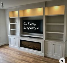 an entertainment center with built - in shelves and a fireplace