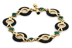 "This is a lovely bracelet is crafted from 14k yellow gold with a polished finish featuring circle links carved from black onyx with yellow gold ring inside each onyx circle, they alternate with s small diamond shape green onyx mounted in solid yellow gold frame. The bracelet has a bar release and fit clasp. It has the 14k gold content stamp. Hallmark: 14k MG Gemstone: green and black onyx Material: 14k rose gold Material: 14k yellow gold Measurement: 7.5\" long x 0.65\" wide x 0.13\" high Weigh Green Polished Jewelry For Evening, Polished Green Jewelry For Evening, Green Polished Evening Jewelry, Green Polished Finish Evening Jewelry, Elegant Green Jewelry With Black Enamel, Luxury Oval Green Onyx Jewelry, Green Onyx Round Beads Bracelets, Luxury Green Onyx Gemstone Beaded Jewelry, Green Onyx Round Jewelry