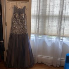 Beautiful Beaded Bluish Gray Jovani Gown. Never Worn. New With Tags. Gray Evening Dress With Sweep Train For Prom, Gray Sweep Train Evening Dress For Prom, Gray Prom Evening Dress With Sweep Train, Gray Sweep Train Prom Evening Dress, Gray Floor-length Evening Dress For Prom, Gray Floor-length Prom Evening Dress, Gray Floor-length Prom Season Gown, Gray Floor-length Gown For Prom Season, Gray Sleeveless Party Gown