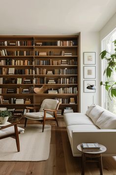 a living room filled with furniture and bookshelves