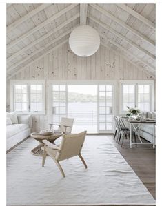 the instagram page on instagram shows an image of a living room with white furniture and