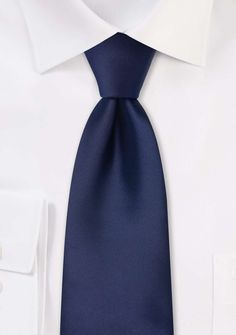 Elevate your style with the understated sophistication of our Navy Solid Necktie. Timeless and versatile, this necktie is a must-have when shopping for mens suits or seeking the perfect accessory to complete your tuxedo ensemble. The rich navy hue exudes confidence and class, making it the ideal choice for formal occasions such as weddings or black-tie events. Its solid design allows for endless pairing options, effortlessly complementing a range of suit colors and patterns. Whether you're aimin Elegant Solid Bow Tie, Dapper Solid Color Ties, Dapper Standard Ties For Office, Dapper Standard Tie For Office, Dapper Office Ties, Dapper Business Ties, Modern Standard Tie For Semi-formal Events, Modern Standard Tie For Semi-formal Occasions, Elegant Formal Ties