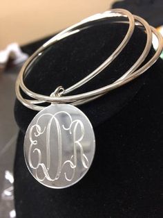 "Make this Triple Silver Bangle set yours, or make someone else feel oh so special.... Lovely gift for bridesmaids, teacher, mom, birthday and much more! details Bracelet is 7\" round 2 1/2\" wide 1\" Disc German SIlver Metal Can be engraved with a Single Initial or a Monogram Please comment with initial initials for monogram, in order to appear, in the Notes to Seller Section.... Happy Shopping Thanks so much!" Personalized Silver Bangle, Sterling Silver Bracelets With Engraving For Weddings, Elegant Silver Bangle For Personalized Gift, Elegant Silver Bangle As Personalized Gift, Sterling Silver Charms Bracelets For Wedding, Silver Bracelets With Engraving Option For Wedding, Silver Wedding Bracelets With Engraving Option, Nickel-free Sterling Silver Bangle For Wedding, Silver Initials Bracelets For Wedding