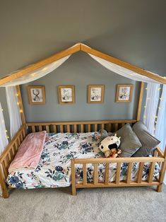 a bed with a canopy over it in a room