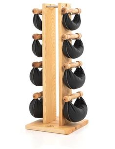 a wooden rack with black leather bags on it