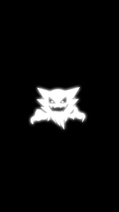 a black background with an image of a cat's head in the middle of it