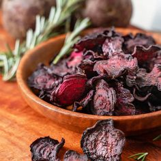 dried beets in a wooden bowl with rosemary sprigs