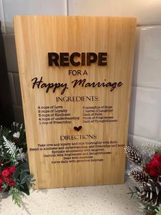 a wooden sign that says recipe for a happy marriage on the side of a counter