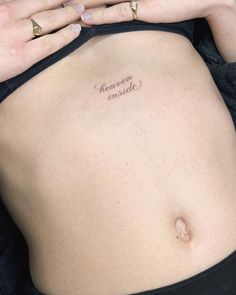 a woman's stomach with the words heaven inside written on her belly and hand