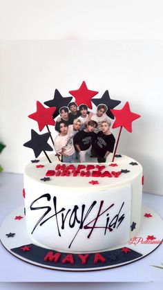 a white cake with red and black stars on it