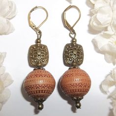 These Wooden Bohemian Style Beaded Earrings Are Sure To Get You Lots Of Compliments. Brand New & Handmade By Me - Wvluckygirl. Done With Brown Wooden Beads With An Edgy Rustic Tribal Vibe Pattern On Them With A Few Black Scuffed Dots Here And There. They Have Rustic Antiqued Brownish Bronze Toned Costume Jewelry Beads. The Pair Dangle & Drop From Lever Backs For Women's Pierced Ears. Measure 2 1/4 Inches Tall & 5/8 Inches Wide. Each Single Earring Weighs 4.7 Grams. Would Make A Great Gift Idea F Bohemian Brown Beaded Nickel-free Earrings, Brown Bohemian Earrings With Round Beads, Bohemian Brown Pierced Earrings, Vintage Brown Earrings With Dangling Beads, Vintage Brown Beaded Dangle Earrings, Bohemian Brown Beaded Earrings For Gift, Vintage Brown Round Bead Earrings, Vintage Brown Beaded Earrings, Vintage Brown Beaded Earrings For Gift