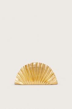 Wearable art, the Nala Mini Clutch is a fanned-style clutch created by pleating luxuriously soft metallic-hued smooth napa leather. The shell shaped silhouette comes in an eye-catching shiny Gold and an invisible magnetic closure keeps all of the essentials safe. Wedding Guest Clutch, Gold Clutch Bag, Cult Gaia Bag, Brushed Brass Hardware, Gold Handbag, Gold Purse, Luxury Clutch, Gold Clutch, Swimming Bag