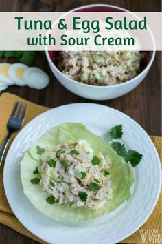 tuna and egg salad with sour cream in lettuce leaves on a white plate