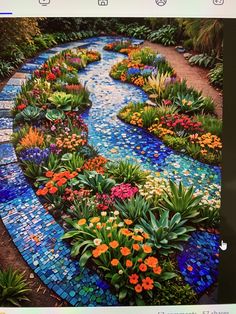 an image of a colorful garden with flowers on the ground and water running through it