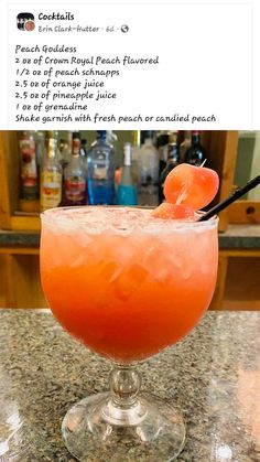 an orange drink sitting on top of a counter