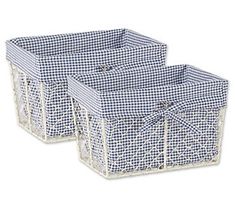 two blue and white baskets sitting next to each other