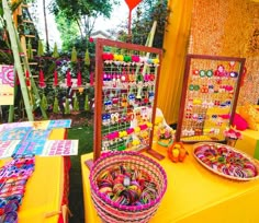 two baskets are sitting on the table next to each other and there is a balloon in the background