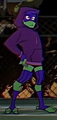 the teenage mutant ninja is standing in front of a fence with his hands on his hips