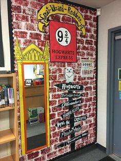 a brick wall with harry potter's express signs painted on it and bookshelves in the background