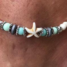 White Beach Anklets With Starfish Charm, White Starfish Charm Anklet For Beach, Beach Season Strand Anklet With Starfish Charm, Turquoise Anklet With Starfish Charm As Gift, White Starfish Anklets As Gift, White Starfish Anklets For Gift, Turquoise Anklets With Starfish Charm For Beach, Turquoise Starfish Charm Anklet As Gift, Turquoise Beach Anklets With Starfish Charm