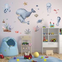 a child's room decorated in pastel colors with sea animals and marine creatures