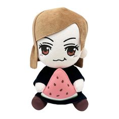 a small stuffed doll with brown hair and eyes, wearing a black shirt and pink watermelon skirt