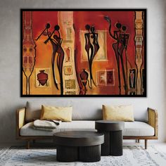 an abstract painting hangs on the wall above a couch