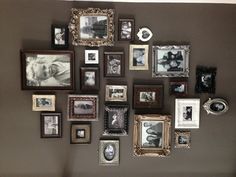 a wall with many different frames on it