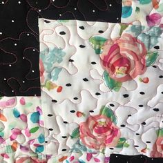 a close up of a piece of fabric with flowers on it and polka dots in the background