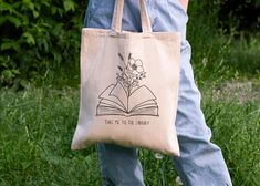 This 'Take me to the library' tote bag exudes a cozy and bookish vibe, perfect for literary lovers and bibliophiles. It is ideal for carrying books, notebooks, and essentials to the library, book club meetings, or literary events. A must-have accessory for bookworms and avid readers, it makes a great gift for birthdays, holidays, and back to school season. Product features - 100% Cotton canvas for durability - Flat corners for a sleek look - Carrying handles for easy transport - Heavy fabric for sturdiness - Available in natural and black colors Care instructions - Do not iron directly over the printed area - print may stick to the iron. - Spot clean - Do not bleach - Line dry Library Tote Bag, Library Tote, Book Club Meeting, School Season, Avid Reader, Color Care, The Library, Sleek Look, Heavy Fabric