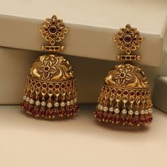 Description These antique jhumki earrings by Tarinika is a timeless design and sure will be your next favorite earrings. Crafted beautifully in nakshi pattern to give a luxurious look to your style. The antique gold color and colorful CZ stones and beads adds unique contrast to the design. Style them alone or match with other Tarinika antique jewelry. Details & Specifications: Materials used: Brass Alloy with Antique Plating Weight – 64 gm Length – 6.5 cm Make it custom Want to make it a custom Latest Gold Earrings Designs Modern, Jhumki Earrings Gold, Traditional Gold Jewellery, Chocolate Doll, Women Gold Earrings, Golden Jhumka, Gold Earrings Design, Beautiful Gold Earrings, Maharashtrian Jewellery