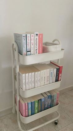 three tiered book cart with books on it