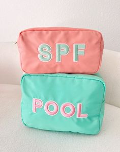 The ultimate poolside bag for sunscreen, mini speaker, snacks and even wet bikinis! XL Teal nylon with pink rolled patches sewn on Ships immediately! Dimensions: 11 x 5 x 8 inches Pink Nylon Travel Cosmetic Bag, Functional Pink Summer Bag, Functional Pink Bags For Summer, Functional Pink Summer Bags, Pink Poolside Bags For Beach Season, Green Poolside Bags For Beach Season, Pink Nylon Bag For Summer, Summer Pink Nylon Bags, Summer Pink Bags For Poolside