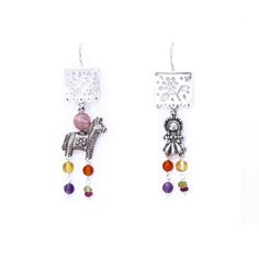 These earrings sound absolutely stunning! They're crafted from silver and feature piñata designs adorned with traditional Mexican muñeca Maria charms.  The designer, Gabriela Sanchez, has taken things to the next level by adding gorgeous touches of amber, amethyst, coral, and turquoise to the design. They are made in Mexico, so you can rest assured that they are authentic and made with incredible attention to detail. You'll definitely make a statement wearing these beautiful earrings! Silver .925 Earrings length: 2.5  inch approx. Papel Picado charm length: .5 inch Burrito and Muñeca charm length: .5 inch Fish hook. Mexican Pinata, Mexican Silver Jewelry, Mexican Earrings, Mexican Jewelry, Traditional Mexican, Beautiful Earrings, Jewelry Earrings Dangle, Women's Earrings, Silver Earrings