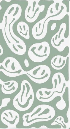 a green and white pattern with swirls on it