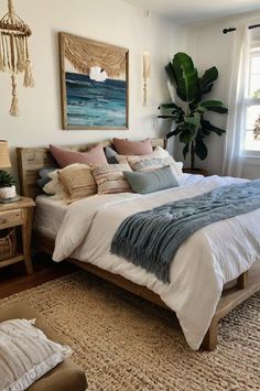 a bedroom with a large bed, rugs and paintings on the wall above it