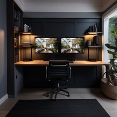 a home office with black cabinets and desk