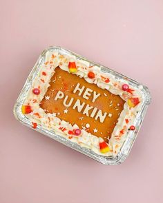 there is a cake that says hey punkin on the top and candy sprinkles all over it