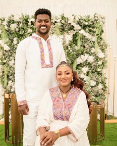 a man and woman standing next to each other