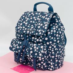 Brand New With Tag Kate Spade New York Carley Fleurette Nylon Flap Backpack In Blue Multi Details: Backpack With Magnetic Flap Closure Interior Slip Pockets Exterior Pockets Metal Pinmount Logo Approx. Measurements: 12"H X 10.6"W X 7.4"D Preppy Blue Backpack Bag, Kate Spade School Backpack, Kate Spade School Backpack With Adjustable Strap, Kate Spade Casual Standard Backpack, Kate Spade Casual Backpack, Casual Kate Spade Standard Backpack, Kate Spade Nylon Backpack For School, Kate Spade Casual School Backpack, Casual Kate Spade Bag For School