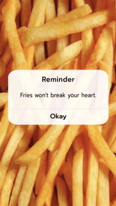 a pile of fries with the caption reminder