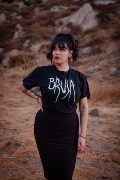 Bruja: Magical Mujer. Mujer Con Poder🖤 100% Cotton Style: T shirt Fit: Unisex fit Care: Wash cold inside out. Tumble dry Low heat. Do not Iron on direct logo. Fitted T-shirt For Streetwear, Alternative Style Short Sleeve Cotton T-shirt, Stretch Grunge T-shirt For Streetwear, Grunge Stretch T-shirt For Streetwear, Alternative Style Crew Neck Cotton Shirt, Alternative Cotton Crew Neck Shirt, Fitted Short Sleeve Grunge Shirt, Alternative Style Cotton Crew Neck Shirt, Fitted Crew Neck Shirt With Band Merch