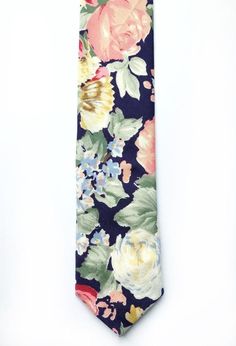 IMPORTANT SHIPPING INFO: Any orders made between Sat 27th July - Weds 7th August will not be shipped until after these dates due to holiday. Please get in touch if you have any further questions, I will be available to answer messages.DESCRIPTION: This lovely men's skinny tie has been handmade using a vintage navy/indigo cotton with a pink, yellow and blue rose print. FABRIC: Vintage Rose & Hubble cotton.LINING FABRIC: Cotton.------------------------------------------------------------------ Summer Formal Ties With Floral Print, Summer Floral Print Tie, Summer Floral Print Standard Tie, Summer Floral Print Ties, Classic Floral Print Ties For Summer, Classic Floral Print Summer Tie, Elegant Summer Floral Print Ties, Elegant Floral Print Summer Ties, Summer Formal Suit And Tie Accessories With Floral Print